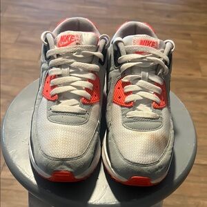 Nike Gray and Red Sneakers with Air Max Cushioning